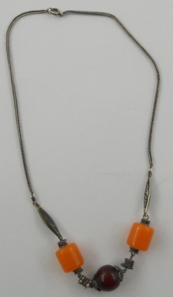 Vintage Middle Eastern Kuchi carnelian/amber neckla: Vintage Middle Eastern Kuchi carnelian/amber necklace, has round pendant. This chain is 18 " long.