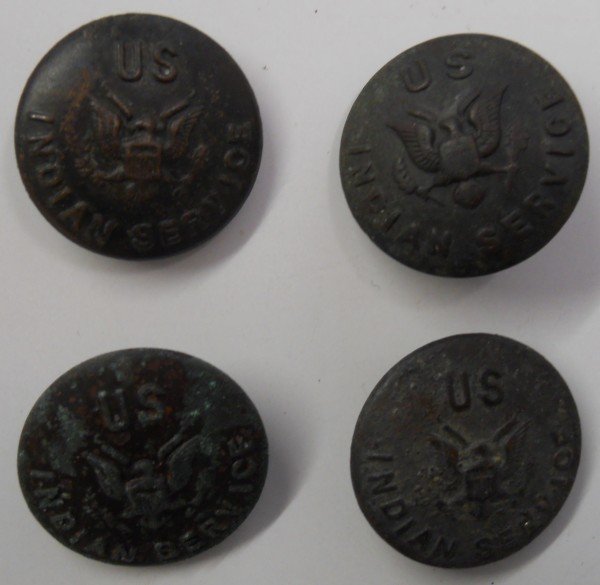 (4) Four Indian Service Buttons: Lot of four "US Indian Service" metal buttons with US eagle motif. Two are marked. One reads: "Marshall Field & Co"; the other is marked: "Mark Cowen & Co. New York" and it has a broken shank. Two of 