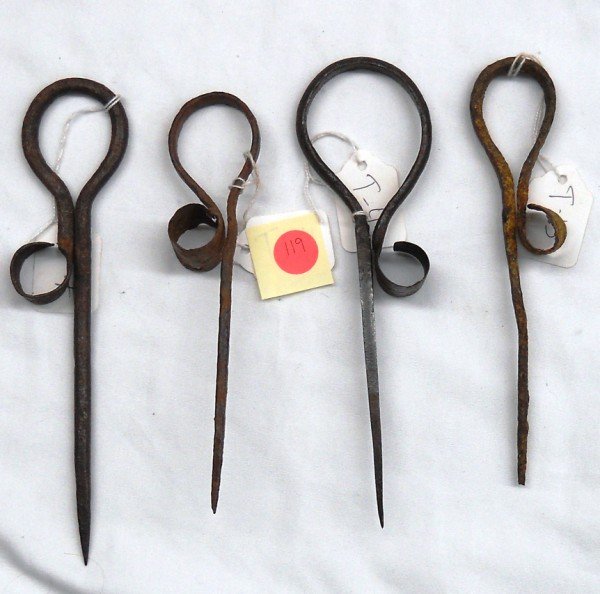 Candlestick Group #4 - Lot of Four: First is an abbreviated model, blacksmith-type candlestick. It contains only a handle, handle neck, thimble and spike. It's in fair condition. It measures to 8" long. [T-4] Next is an abbreviated mode