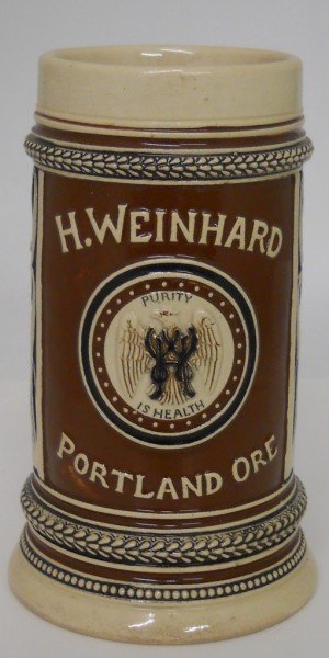 Henry Weinhard Pre-Prohibition Beer Stein: This pre-Prohibition beer stein was used in 1905 at the Lewis & Clark Exposition held in Portland, Oregon. The stein features the Weinhard logo of "Purity is Health" in the center and the majority of 