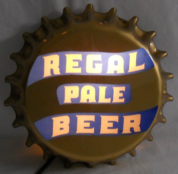 Regal Pale Beer Bottle Cap Sign / Light: This Regal Pale Beer light up sign is from the 1950's. It is made of plastic and aluminum, and looks like a bottle cap. Manufactured for the Regal Amber Brewing Company of San Francisco. The sign can