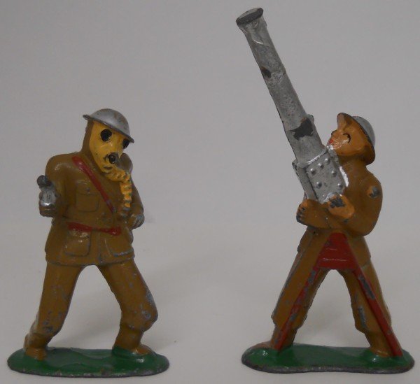 Vintage Lead Soldiers - Lot of 4: This is a lot of 4 vintage WWI lead soldiers - the first one is wearing a gas mask and holding a hand gun #778, the second one is firing a machine gun into the air #774, the third one is holding a mac