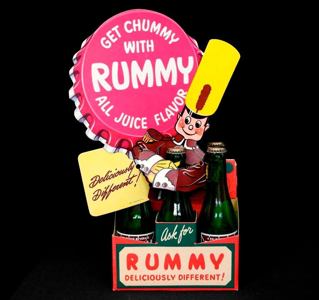 Rummy Soda Bottle Display: Our first lot is for a six pack of Rummy Soda with a neat little thin cardboard display sign. The bottles and six pack look like they were never used. The bottles are empty and have a plain bottle cap