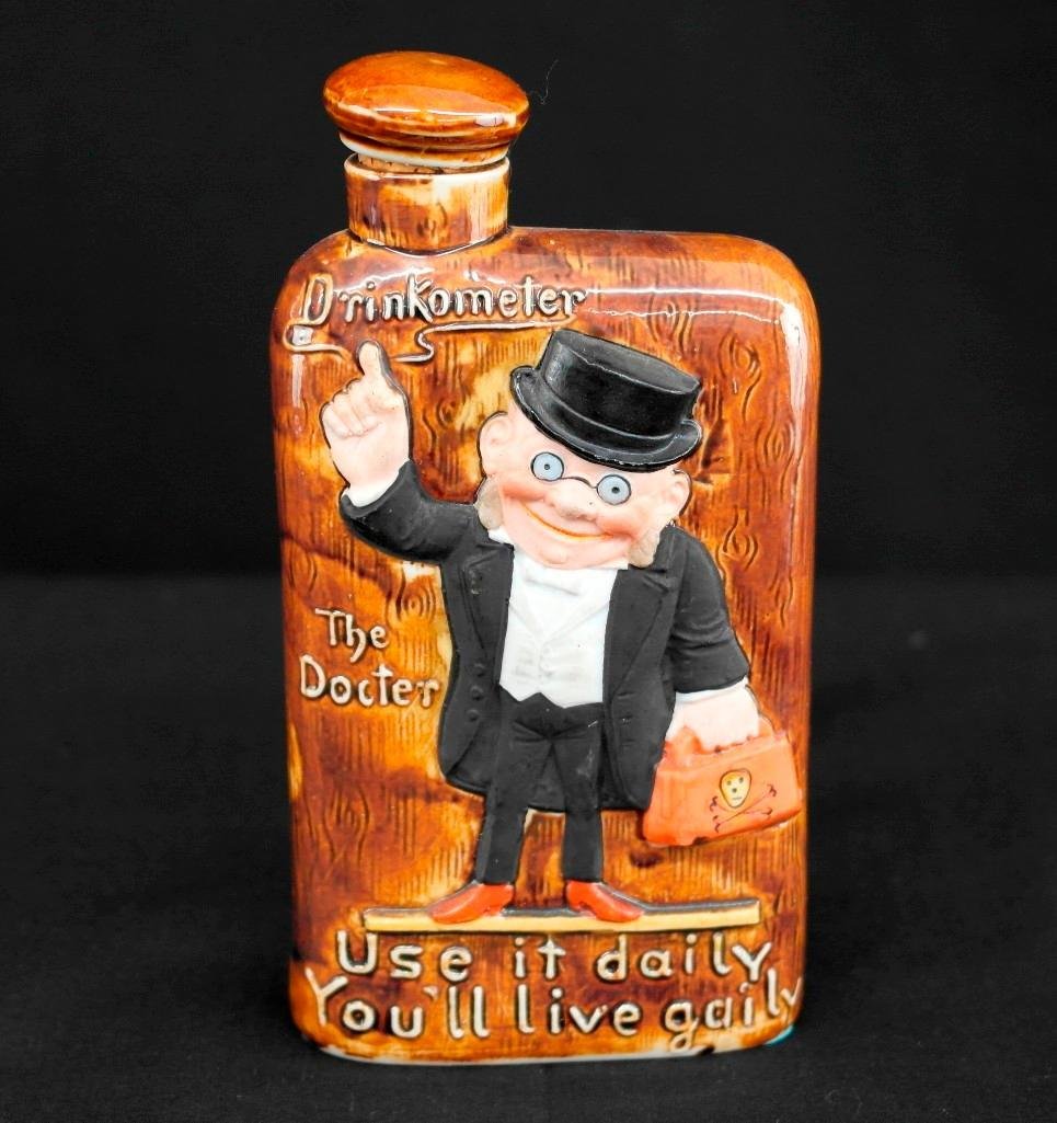 Schafer & Vater Drinkometer Flask - The Doctor -: This Schafer & Vater drinkometer flask features a doctor on one side and the drinkometer itself on the other. The "Docter," as it is misspelled on this particular flask, is in color while the rest of