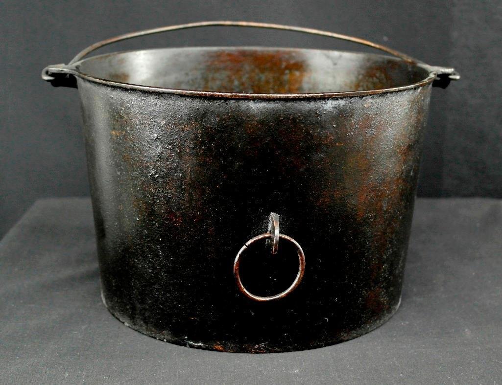 Griswold #8 Flat Bottom Kettle: This Griswold Erie flat bottom kettle #8 is in good condition, with no pitting, cracks or repairs. It has an attached handle for carrying and a soldered ring on the side. There is no lid with this ket