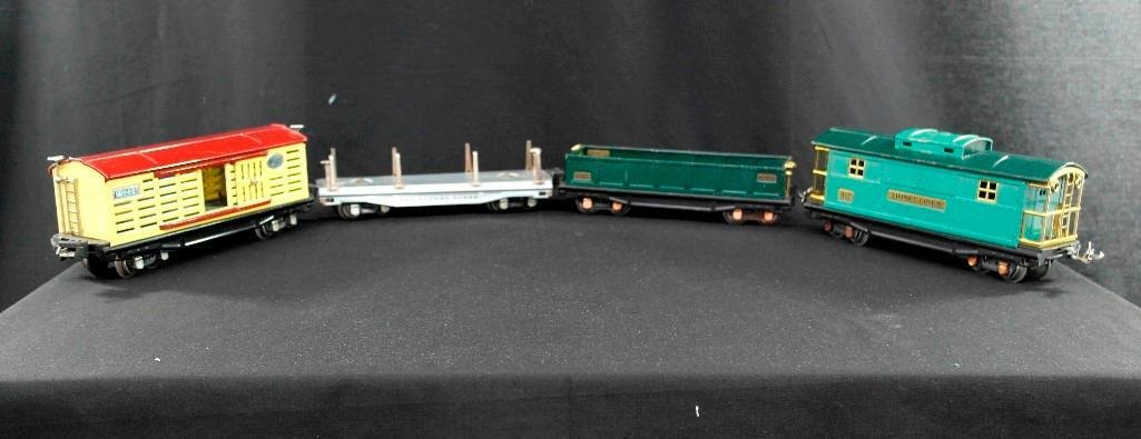 Lionel O-Gauge Train Set - no. 811 Flatcar, no. 812: This vintage Lionel trains set includes four O-gauge pieces, including: no. 811 flatcar (silver) no. 812 gondola car dark green no. 813 stock car (cream/maroon) no. 817 caboose (peacock/green) This se