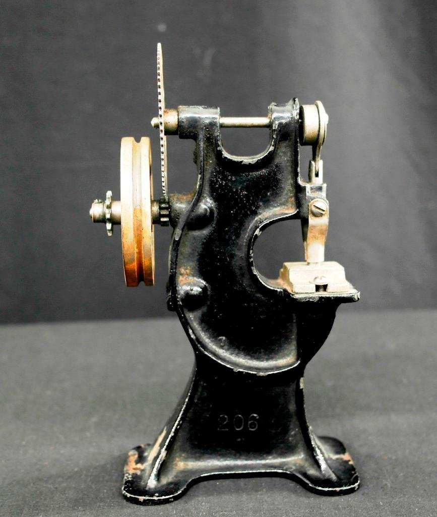 Vintage Toy Model Steam Engine Shop Punch Press: Offered is a cast iron and steel vintage toy punch press. It would have been used with a model steam engine and been belt driven. We tried a piece of paper in the punch and it pressed a clean round ho