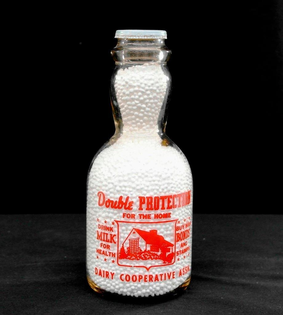 Mayflower War Slogan Cream Top Milk Bottle: This is a quart cream top milk bottle. It is from Mayflower Dairy Cooperative Association based in Portland, Oregon. They operated several regional bottling plants in both Oregon and Washington throug