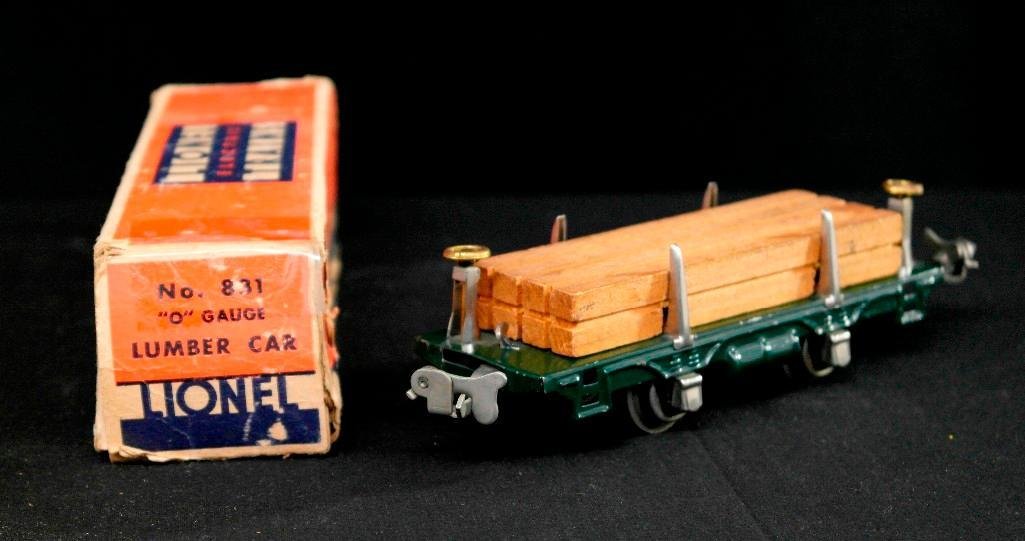 Lionel Trains no. 831 - Lumber Car - O-Gauge - Original: This vintage Lionel Trains piece is no. 831 - Lumber Car. It is an O-gauge piece and comes with the original box and lumber accessory. The box is in fair/poor condition with moderate tape repair. The 