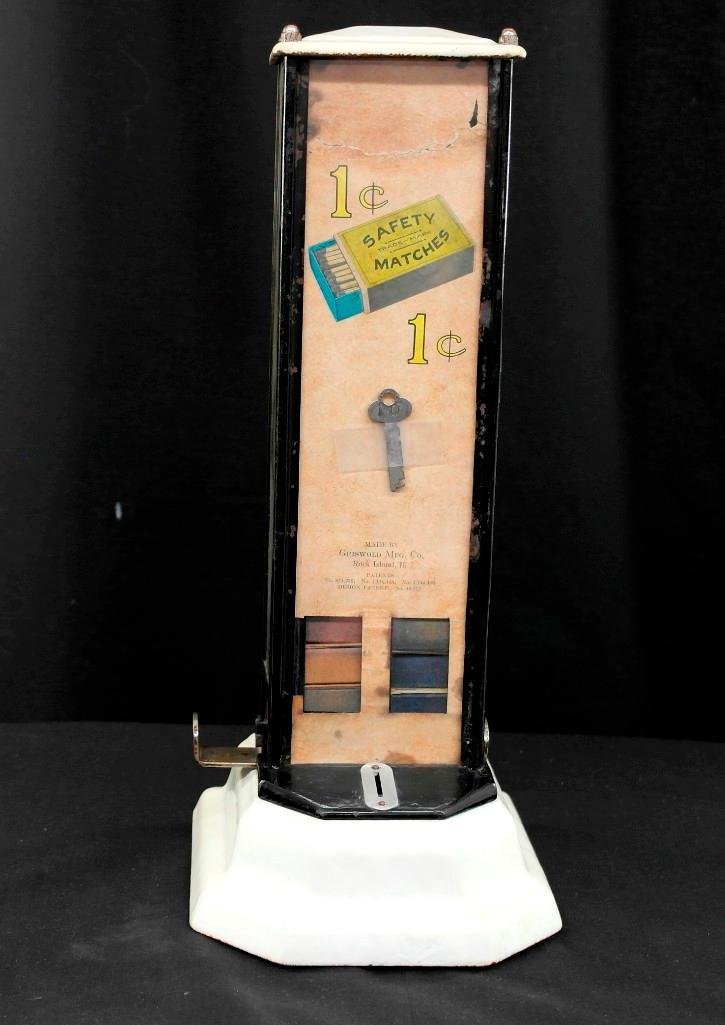 Griswold Mfg. Company 1920 Safety Match Vending Machine: Offered in this lot is a 1920s vintage Griswold Manufacturing Company safety match vending machine. This is a coin operate machine that dispensed the small standard size boxes of wooden Safety Matches