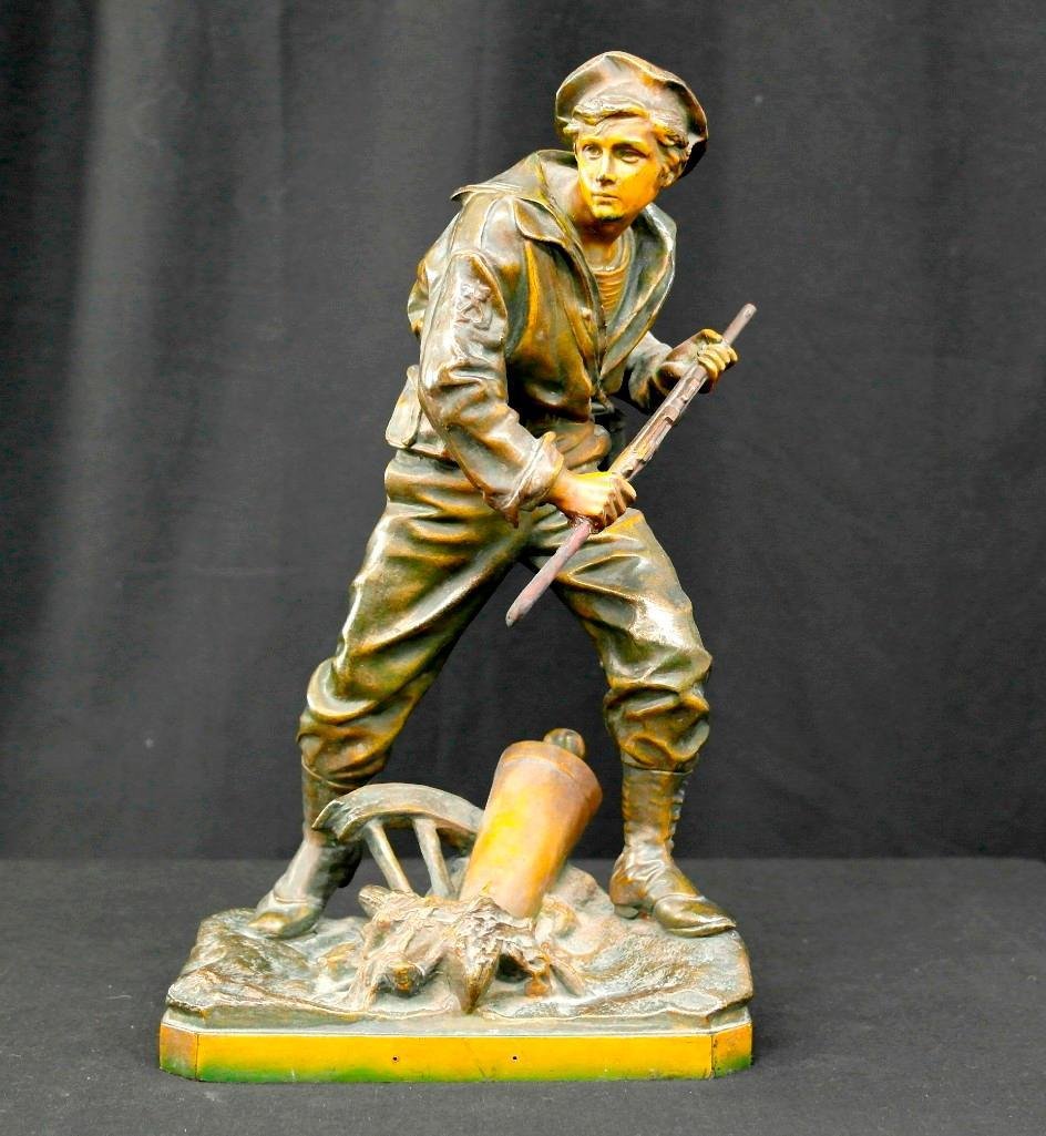Vintage Cast Bronze Statue Sculpture - Soldier Carrying: This vintage cast bronze statue depicts a soldier carrying his rifle into battle. There is debris strewn at the soldier's feet and very vivid detail on his face. The statue itself is hollow with a per