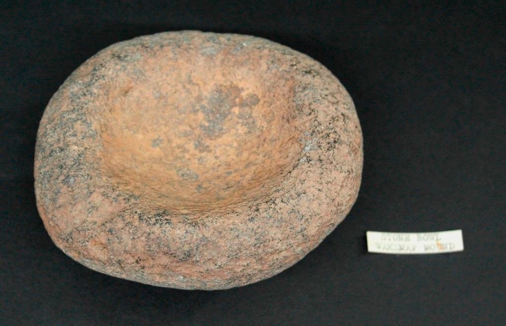 Stone Bowl or Mortar Wakemap Mound Columbia River: This lot is for a stone bowl or mortar found at the Wakemap Mound Site in Washington. It is made out of a coarse stone and is approx. 5 x 4 1/2 x 2 1/2 with a 1 deep bowl in the center and weighs abou