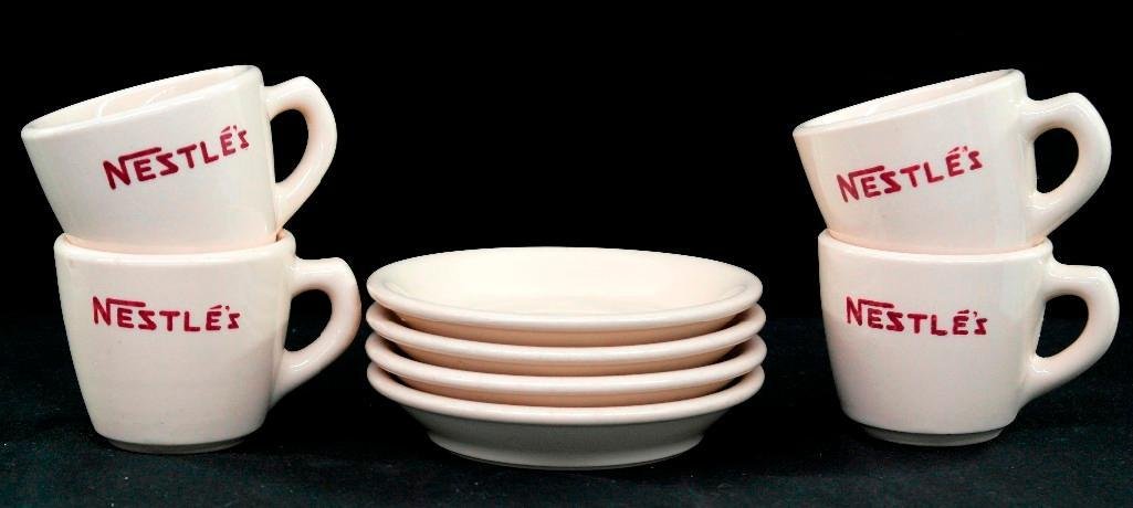 Lot of 4 Vintage 1950s Nestle's Hot Cocoa Cup and: This lot consists of four sets of vintage Nestle's hot cocoa cups and saucers. The pieces are all marked "Sterling China" on the bottom and also bear the "J. L. Pasmantier and Sons" makers mark. The c