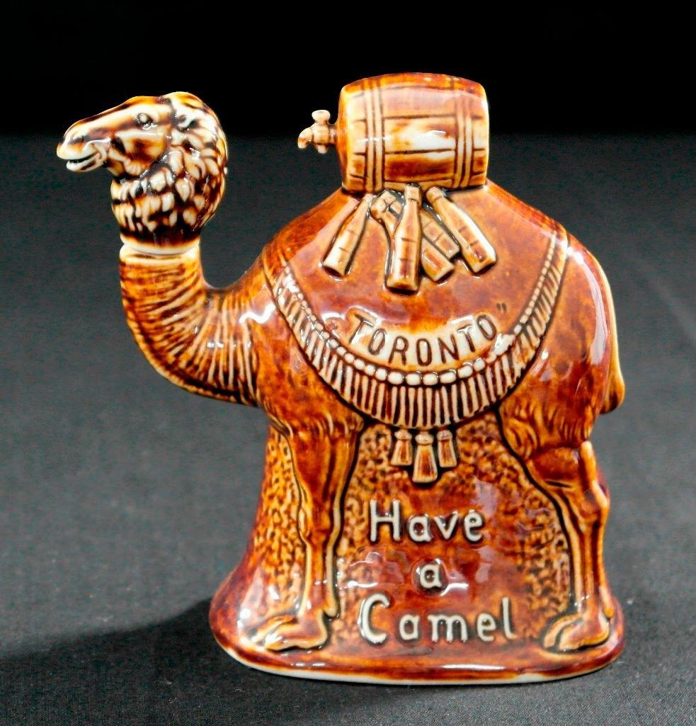 Vintage Schafer and Vater Brown Nipper Flask - "Have a: This original Schafer & Vater piece is a brown nipper flask and is titled "Have a Camel." This piece is also inscribed with "Toronto." The flask is in excellent condition and comes with the original s