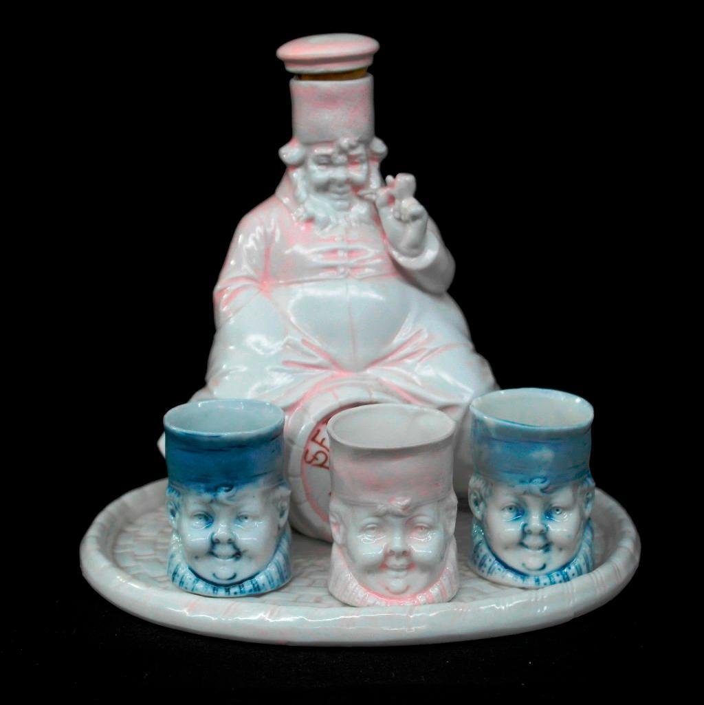 Vintage Shafer and Vater Set - Sedgwick Rye Flask, Oval: This vintage Schafer & Vater set comes with five different pieces. Included are: Sedgwick Rye Figural Nipper - pink w/ original stopper, 5-1/2" tall Set of three (3) Sedgwick Rye cups - two blue and o