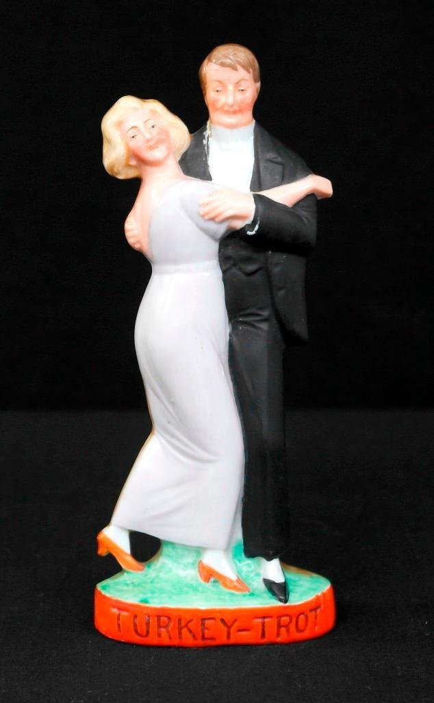 Vintage Schafer and Vater Flask - Color Figural Nipper: This vintage Schafer & Vater flask is a color figural nipper and is titled "Turkey-Trot." It features an elegant couple dancing what we can only assume is the turkey trot. The piece is in excellent co