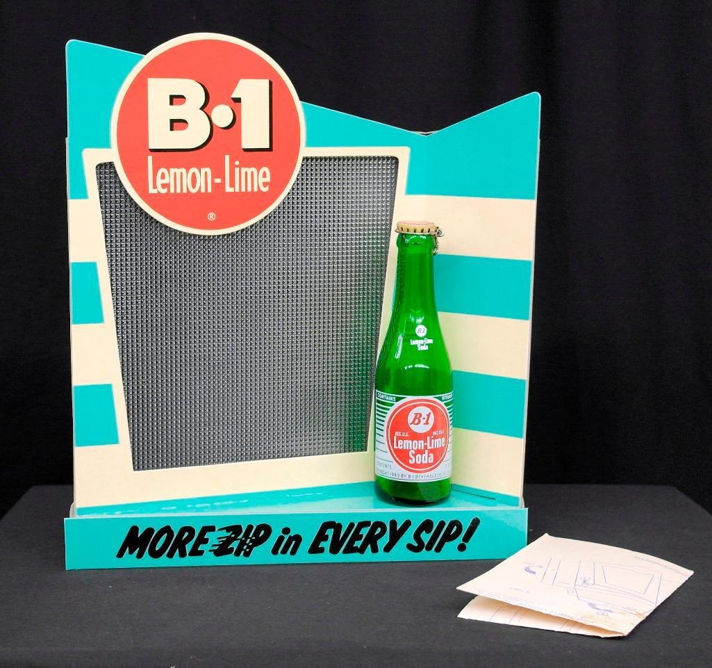 B-1 Lemon-Lime Soda Light Motion Display Sign: Offered is a vintage counter-top display sign for B-1 Lemon-Lime Soda. With the ability to be mounted or hung on a wall, this piece was very versatile. The sign features six colored lights that random