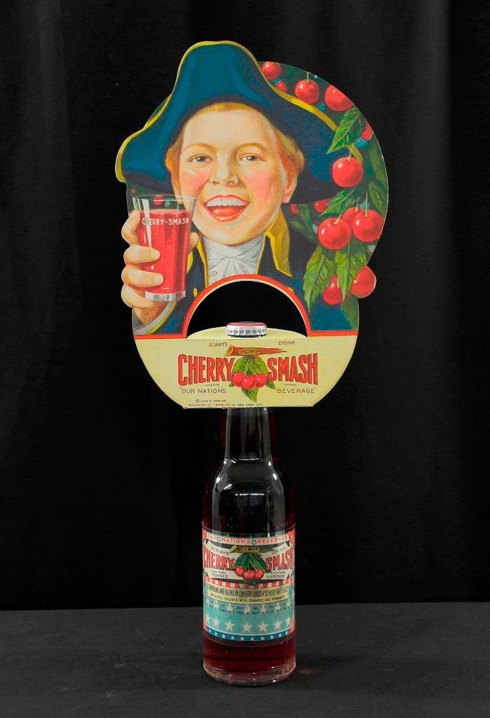 Cherry Smash Bottle and Bottle Topper: Offered is a very colorful display in like new condition. This piece is approximately 17 inches tall (bottle and topper) x 7 inches wide with no creases, bends, or tears. This is one that will stand a