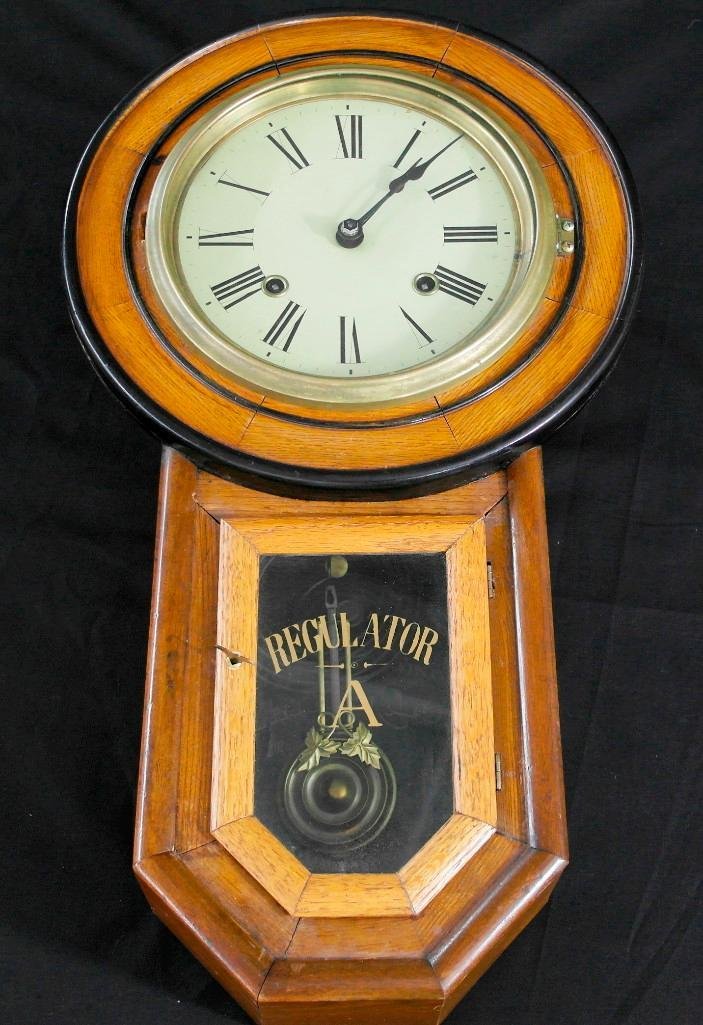 "Regulator A" Hanging Wall Clock by Simon Wittner: Offered is an old wall clock that we believe to be a classic Japanese copy of an Ansonia model. Japanese began cloning Ansonia double arch works and case around 1890. This clock has a tag on rear stat