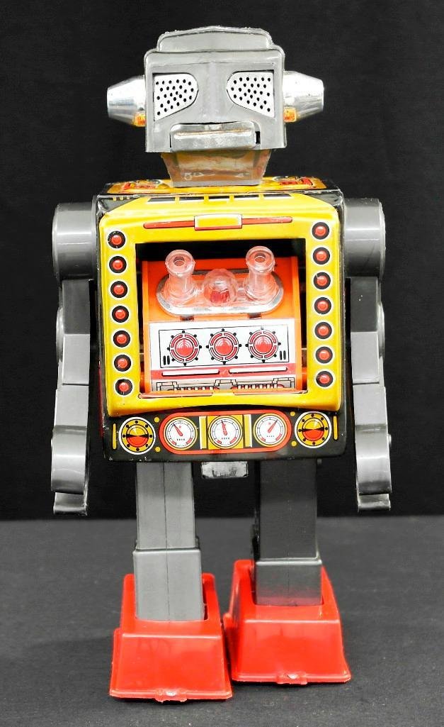 Attacking Martian Robot made in Horikawa, Japan: This tin and plastic battery operated attacking robot was made in Horikawa, Japan. It is approximately 9-1/4 inches tall and is in excellent condition. The battery functions are in good working order.