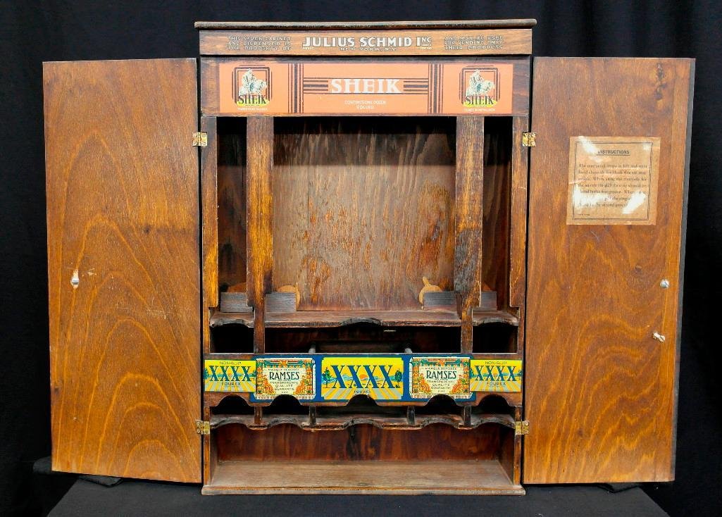 Julius Schmid Condom Cabinet: This plain cabinet was usually behind the counter of drug stores to hold condoms. The front reads "Property of Julius Schmid, Inc.," who sold Sheik condoms among other brands. All the advertising is i