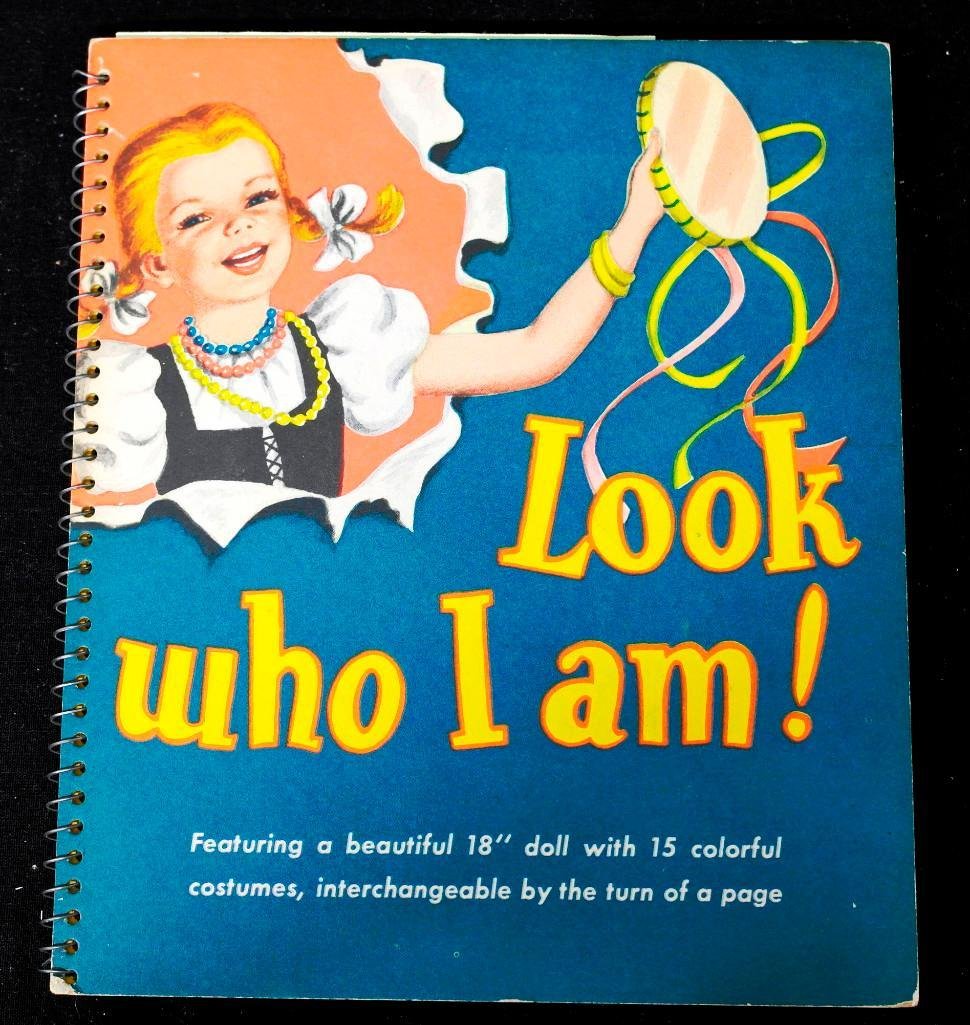 Look Who I Am (A Moveable Book): This "moveable" book was written by Rosemary Shawn, illustrated by Doris Stolberg, and copyrighted in 1952 by Hart Publishing Company of New York. Hinged on the back cover is a head and two legs of a