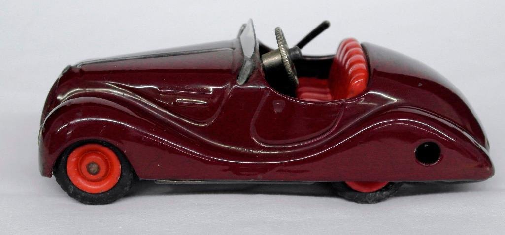 Schuco Akustico #2002 Wind-Up Tin Toy Car: This lot is a #2002 Schuco Akustico wind-up tin car made in Germany just after World War II. This toy has an operating horn, on/off lever, and comes with the original key for winding it up. The car is