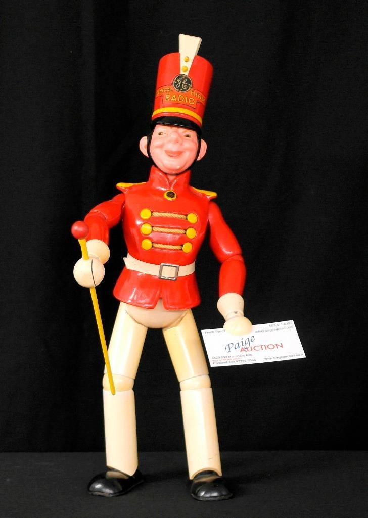 General Electric Wooden Advertising Doll: This General Electric Advertising Doll was made in the 1930's and was called the "Radio Man Marching Bandmaster." The doll stands on his own and is approximately 19" tall. All the parts are there (som