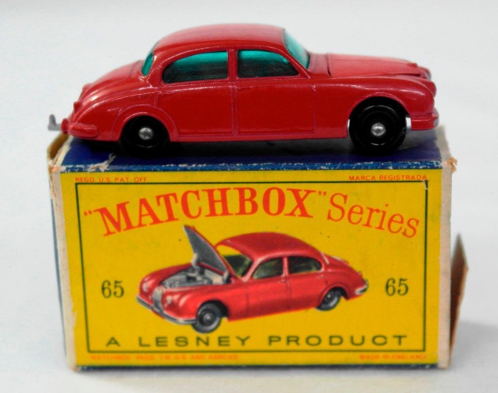 Matchbox #65 Jaguar 3-8 Sedan with Box: This auction is for a vintage Lesney Matchbox Series No. 65 Jaguar 3-8 Sedan with the original box. The box states, "Matchbox Series 65,A Lesney Product,65 Jaguar 3-8 Sedan." The bottom of the car sta