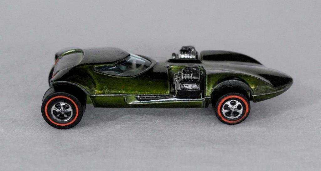 Olive Redline Twin Mill Hot Wheels Car: This olive-colored Redline Hot Wheels car was designed by Ira Gilford and was manufactured from 1969 until 1971. The Twin Mill has become one of the most recognizable and popular Hot Wheels casting fo