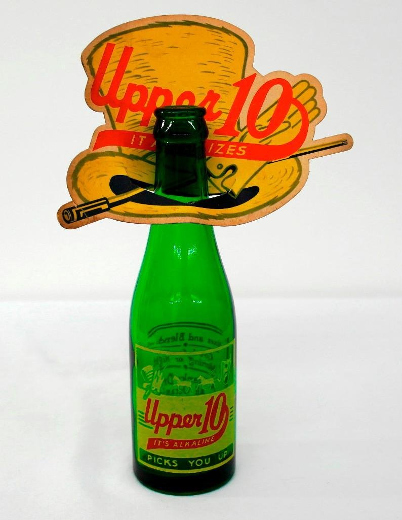 Upper 10 Bottle and Topper: This lot is for an Upper 10 bottle and topper. This seven-ounce bottle was filled by Nehi Bottling Company of San Jose, California and measures approximately 8" tall. The topper is in the image o