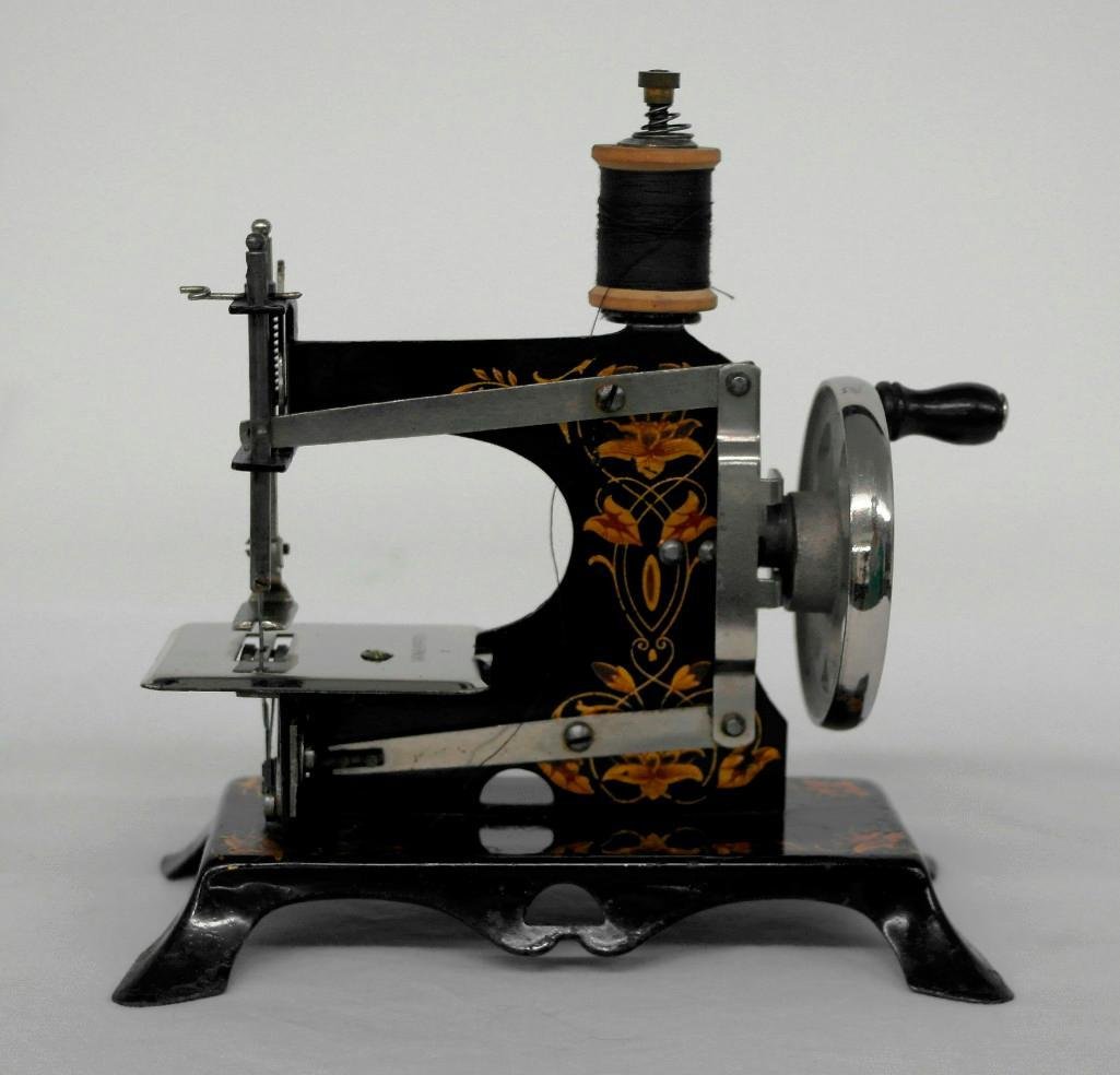 Lindstrom's "Little Miss" Sewing Machine: This "Little Miss" sewing machine was made in Germany and distributed by Lindstrom Tool & Toy Company of Bridgeport, Connecticut. The machine runs very, very smoothly, and all parts