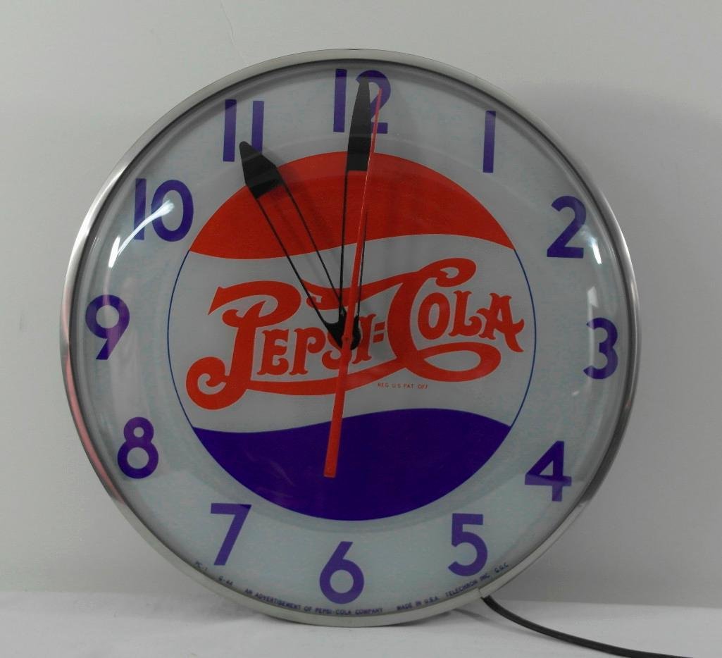 Pepsi-Cola Double-Dot Clock: Offered is a WWII era Pepsi-Cola lighted clock. This clock has the old double-dot Pepsi:Cola logo and looks to have been made during the war. There is a minimal amount of metal used to make the clock