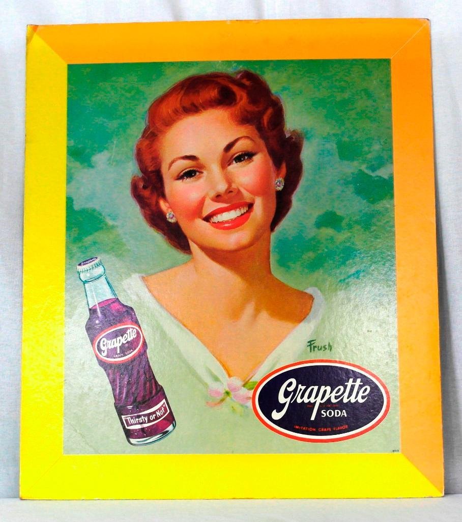 Grapette Cardboard Sign by Frush: This beautiful girl was drawn by Frush for Grapette Soda. From the shape of the bottle, we would say circa 1940s. It's in really great condition, with only a little bump on the upper left corner. We a
