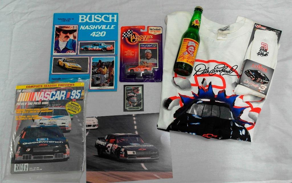 NASCAR Superstar Dale Earnhardt, Sr. Goodwrench #3: Offered in this lot are eight (8)Dale Earnhardt NASCAR mementos: unused t-shirt (size L); one pair of white socks (size 10-13) in original packaging; 1983 Busch Nashville 400 official souvenir program