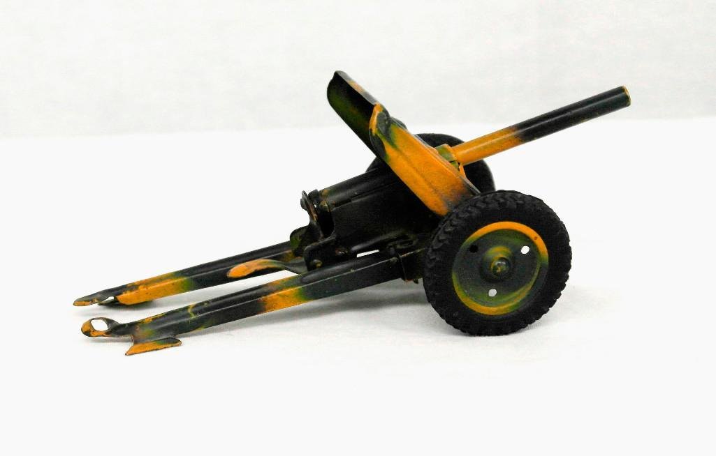 1930s 37MM Anti Tank Gun: This anti-tank gun was made in "Germany in the 1930s by either the Hausser or Lineol Toy Company. It seems to be made of tin and is complete. The firing mechanism, although a little rusty, works fine 