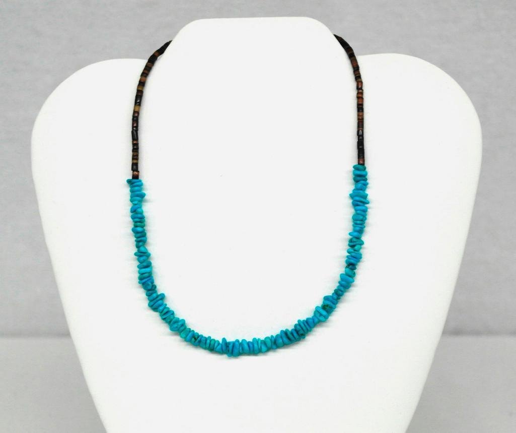 Tourquoise Heshi Beaded Necklace: This choker necklace consists of heshi beads of turquoise beads and brown/tan beads. It measures 16" long and is a very pretty, delicate necklace.