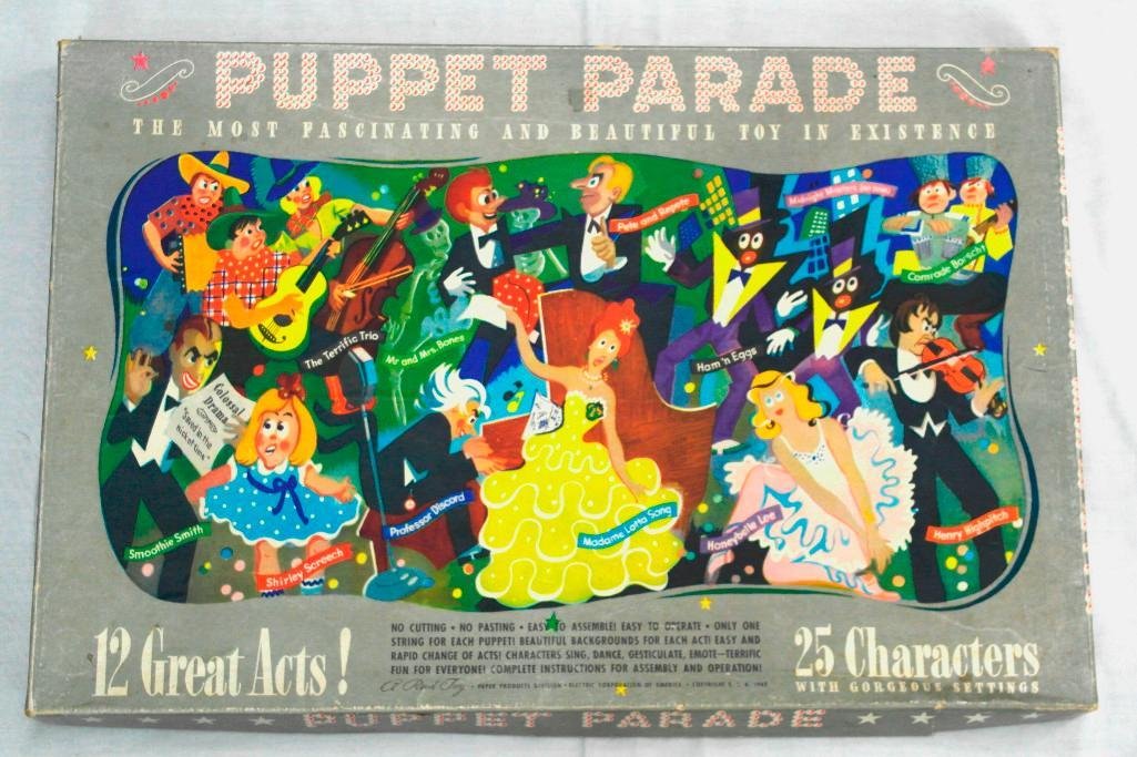 Un-Cut - The Puppet Parade " The Most Fascinating And: This punch out toy was made by Reed Toy, Paper Products Division, Electric Corporation of America dated 1943. Included are characters to be punched out, scenery and a complete set of instructions. It 