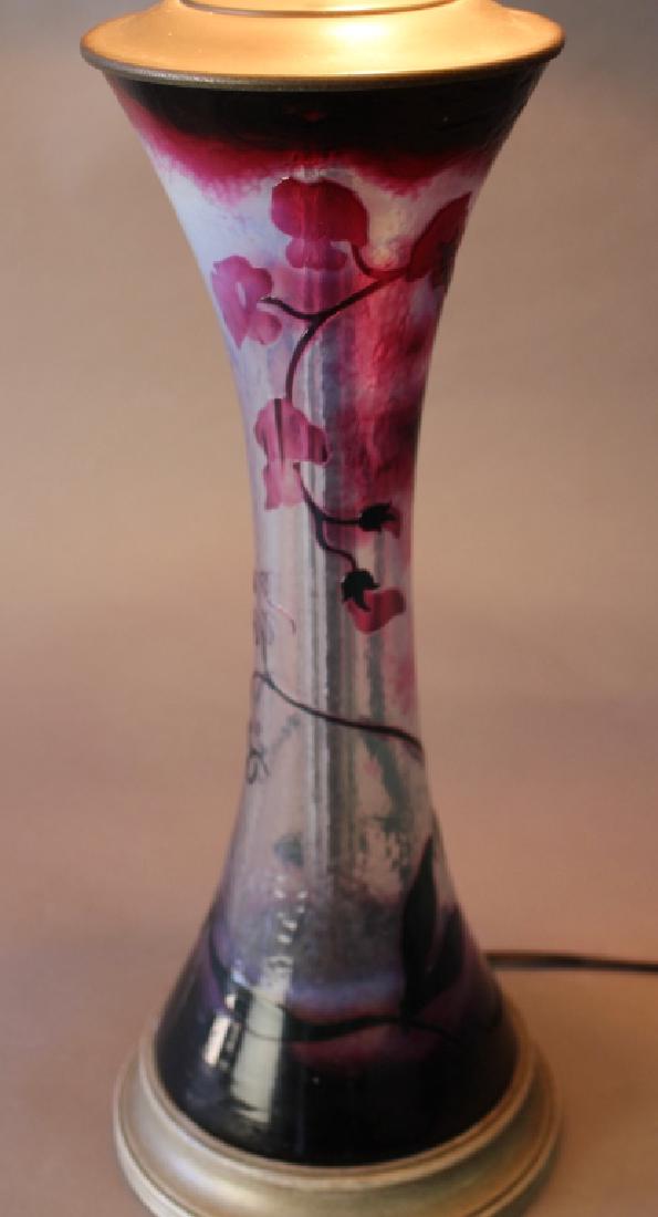 Daum, Nancy Cameo Glass Lamp Base: Daum, Nancy cameo glass lamp base with fixtures, signed on bottom, deep reds, mottled clear glass and almost black tendrils and foliage. Vase is 15.25" with fixtures to finial 32", good condition, dri