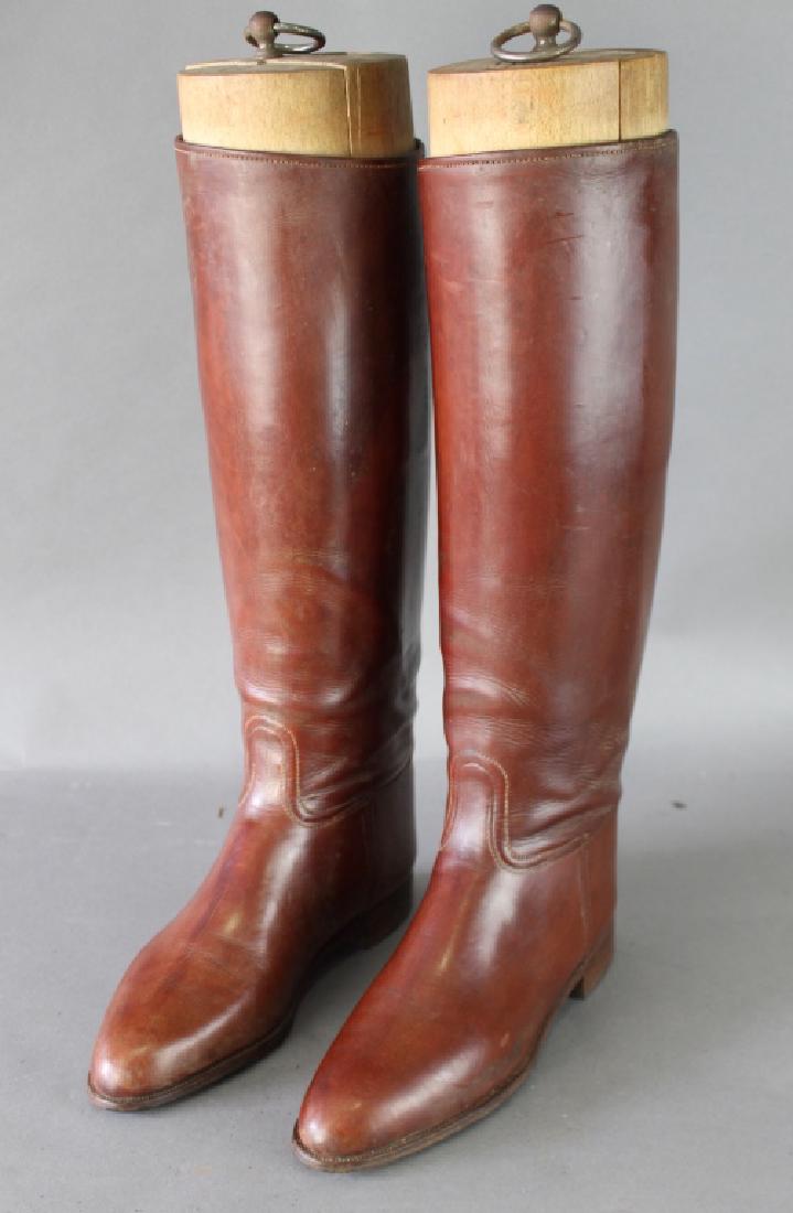 English Riding Saddle, Boots and Extras: English riding saddle, riding boots with wooden stays, crops, stirrups, bit and all leather strapping, in custom storage box, all leather straps are intact, pliable and just need conditioning. Photo i