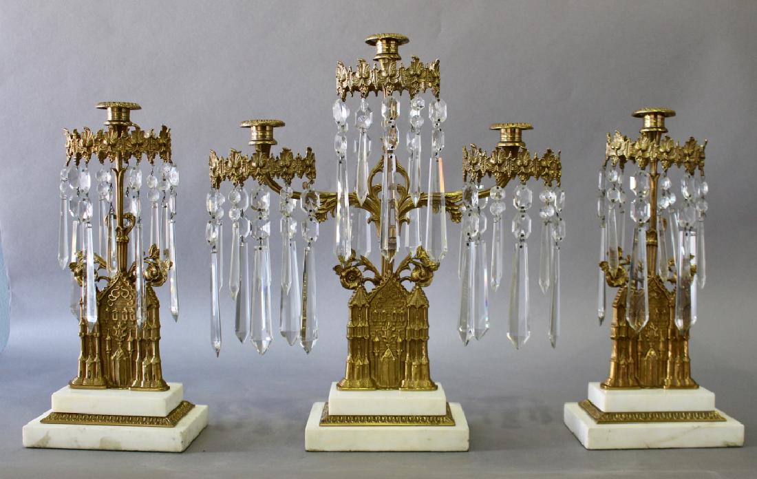 Three Piece Gothic Revival Girandoles Set: Three piece Gothic Revival girandole set, unusual church or cathedral motif, this set is in near mint condition excluding some minor flakes and chips on a few of the prisms, center 3 light holder 18.7