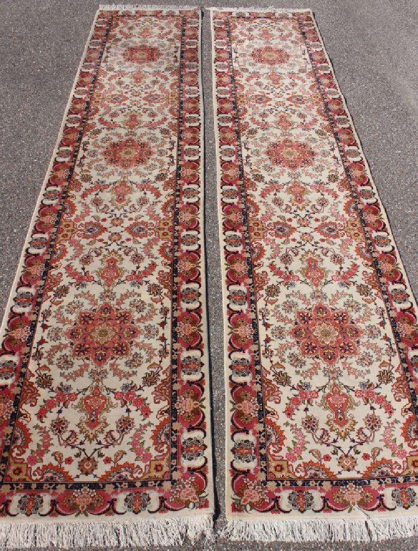 Two Matching Oriental Runners 13.9' x 2.9': Two matching handmade Oriental runners, each 13.9' x 2.9', rose background with red floral borders, both in good condition.