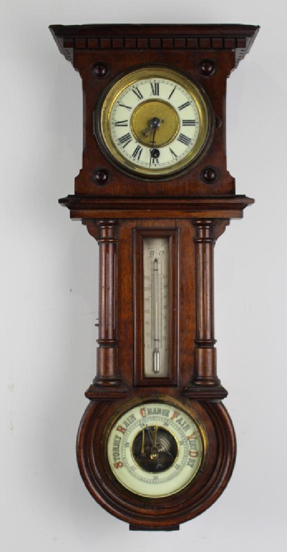 Petite Regulator Wall Clock and Barometer: Petite regulator wall clock with built in barometer, 21" x 9" x 4.5", walnut case, porcelain clock face with Roman numerals, centigrade and fahrenheit registering thermometer and working barometer. Al