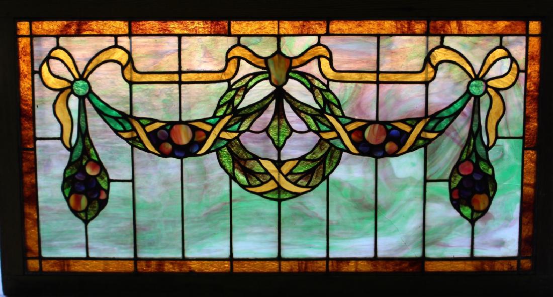 Leaded and Stained Glass Transom Window: Leaded and stained glass transom window, showing festooned wreath and garland, 44" x 24" frame, 2 cracked panel sections.