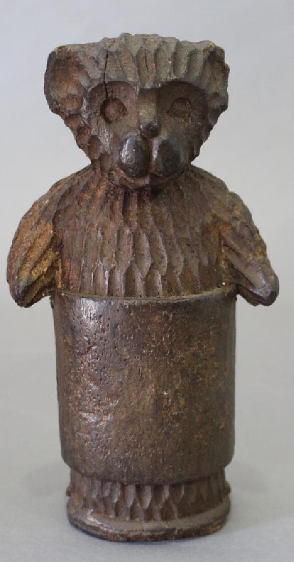 Whimsical Folk Art Carved "Bear in a Barrel": Whimsical folk art carved wood standing "Bear in a Barrel", 9", some loss to exterior.