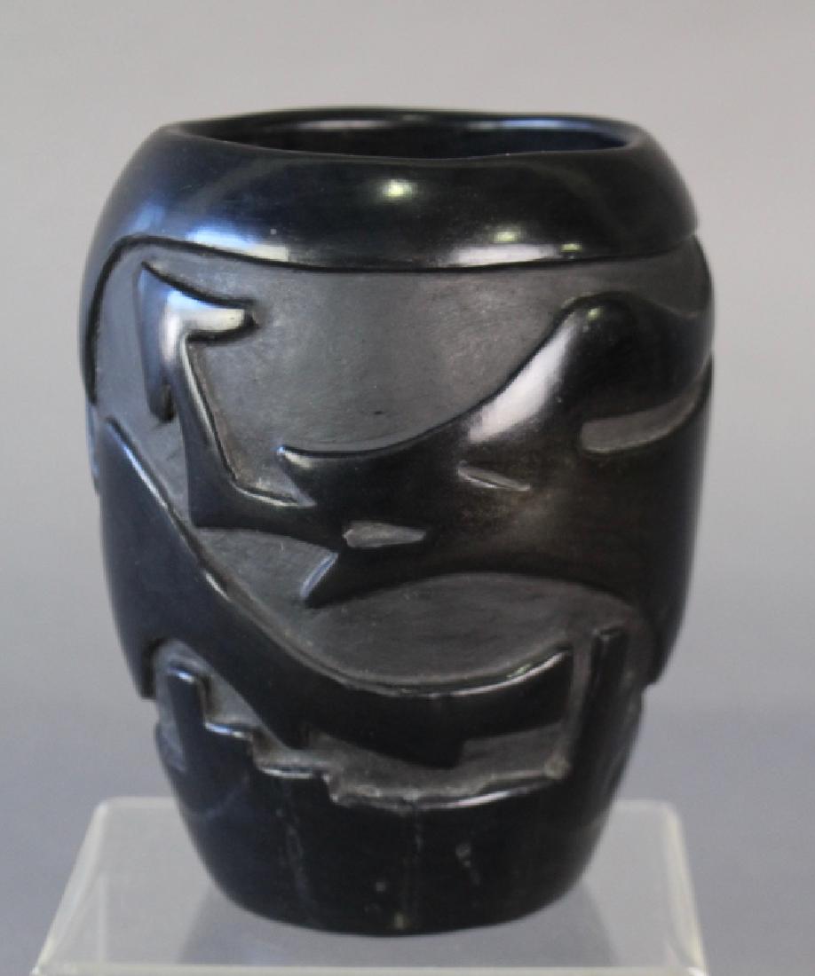 Santa Clara, Pueblo Pottery Vase: Santa Clara, Pueblo, black on black pottery vase, artist signed Frances M. Chavarria in pencil. Deep incised stylized wolf design, 7", great condition.