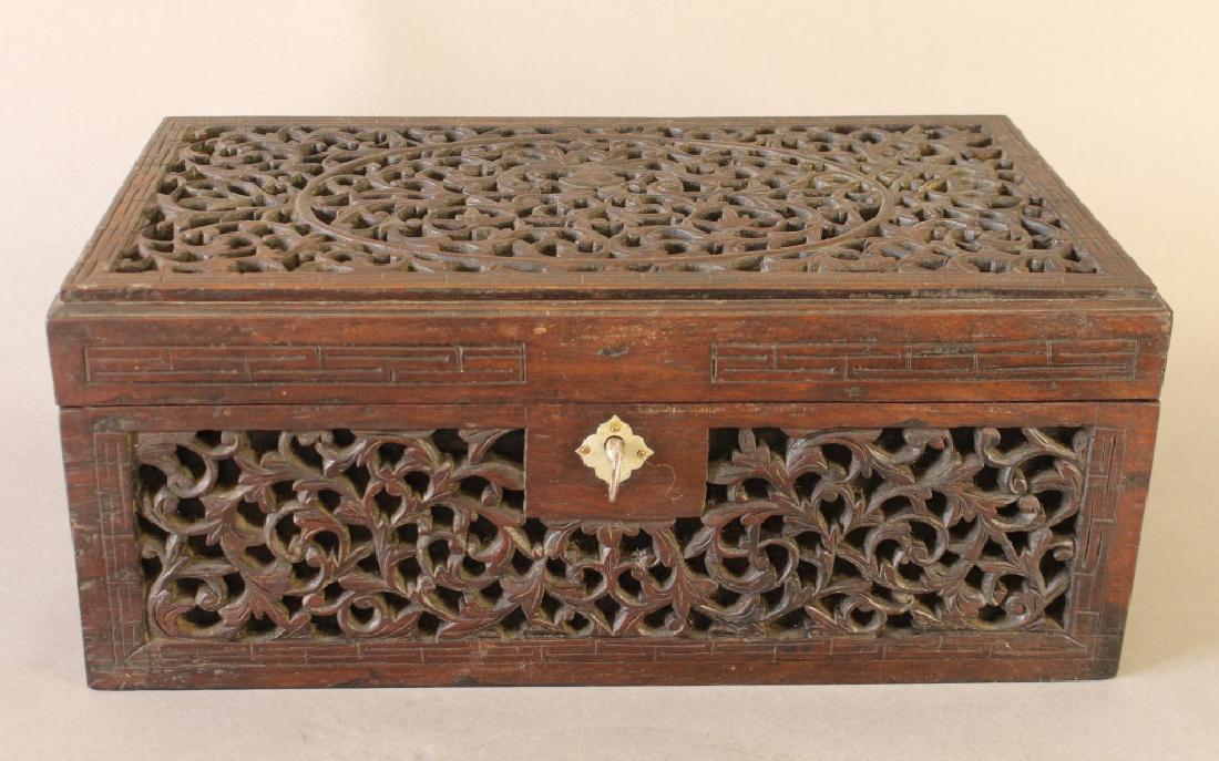 Anglo-Indian Carved Humidor: Anglo-Indian pierce carved hinged locking humidor, c. 1880, 5 intricately carved sides with brass lock, 5.5" x 13" x 7.5", good condition.