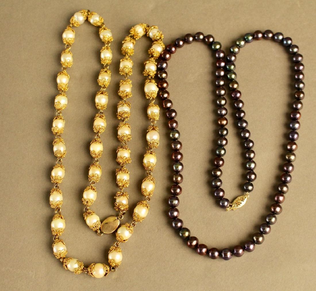 Two Pearl Necklaces: Two pearl necklaces: 4mm 22" black pearl necklace with 14K gold clasp and a 26" natural pearl necklace with gold wire filigree between each pearl, most unusual.