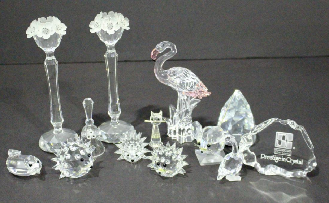 Swarovski Crystal Group: Swarovski crystal group: Dealer sign, pair 7.5" candle holders, faceted paperweight, 3 sizes of hedgehogs, 6" flamingo, duck, goose, cat, bell, and mouse, 13 pieces, all mint condition.