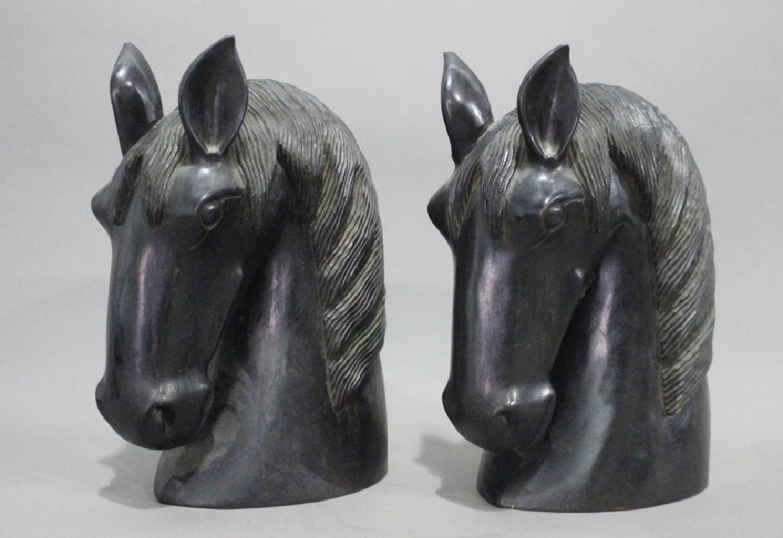 Pair of Large Carved Wooden Horse's Heads: Pair of carved wood horse's heads, each from solid block of wood (we think mahogany) with ebonized finish, both perfectly matched, 15" h x 10" d x 7" w, good condition with normal natural wear, very A